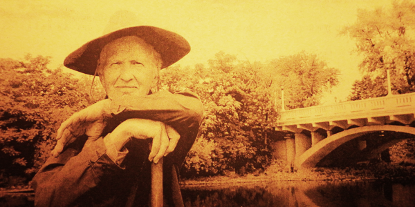 An old news photo of my dad posing where years earlier he launched a 1700 mile solo canoe trip down the Mississippi river from Aurora IL to New Orleans