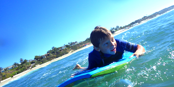 Austin learning to body surf in the Malibu sun